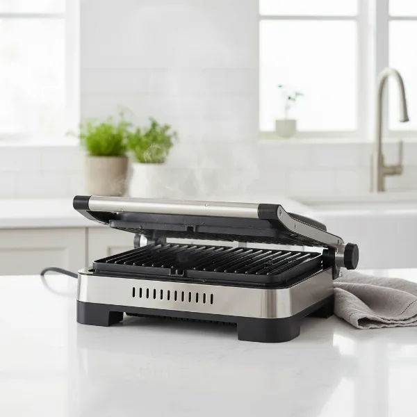 Electric grill plates cooling down on a counter after use