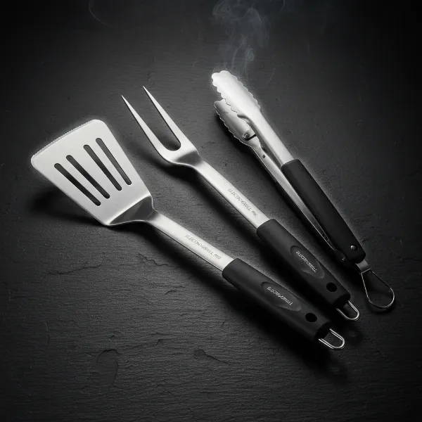 A complete set of long-handled stainless steel grilling utensils including spatulas, tongs, and a fork.